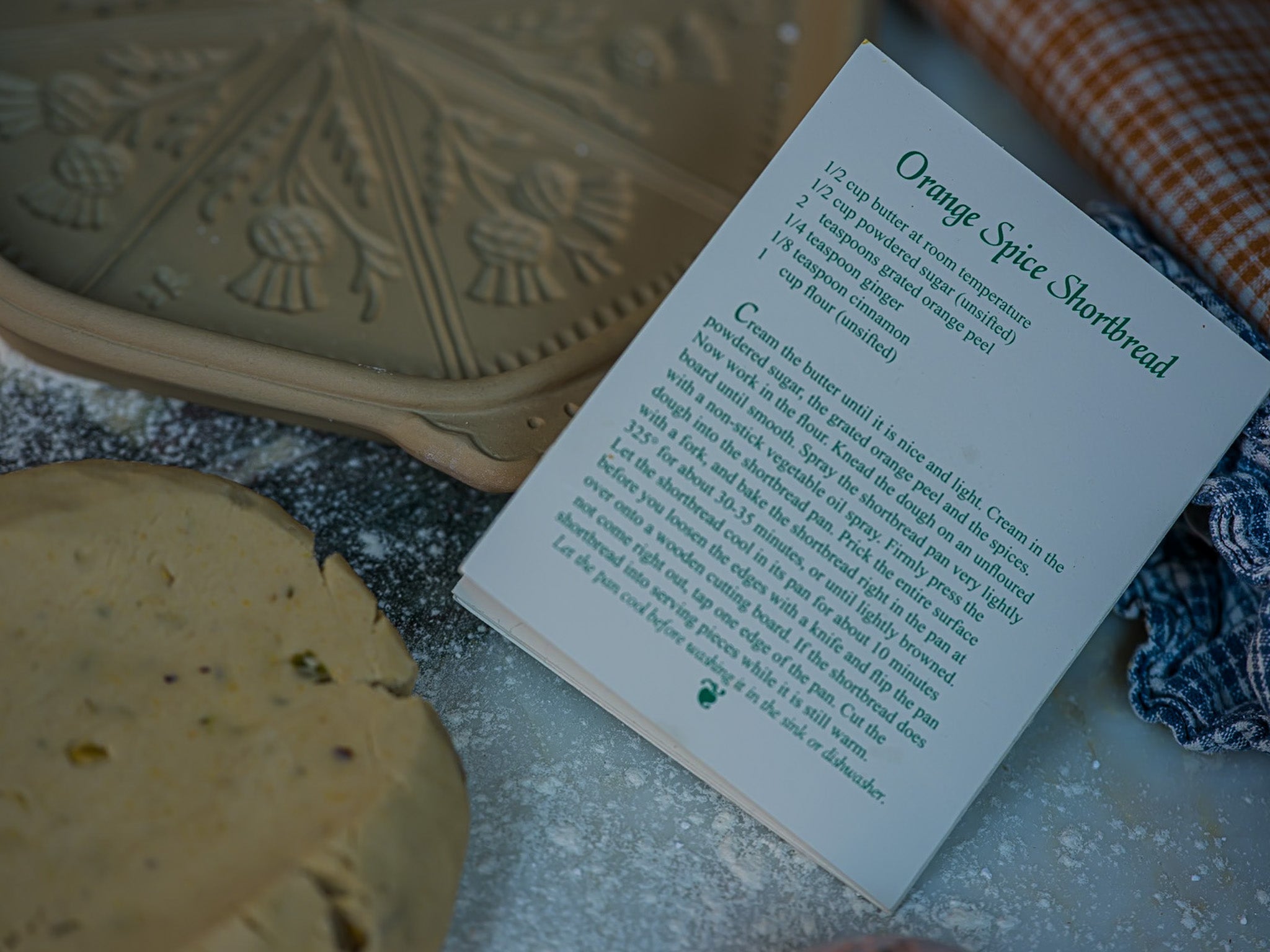 three classic sugar cookies stamped with an impression of a thistle