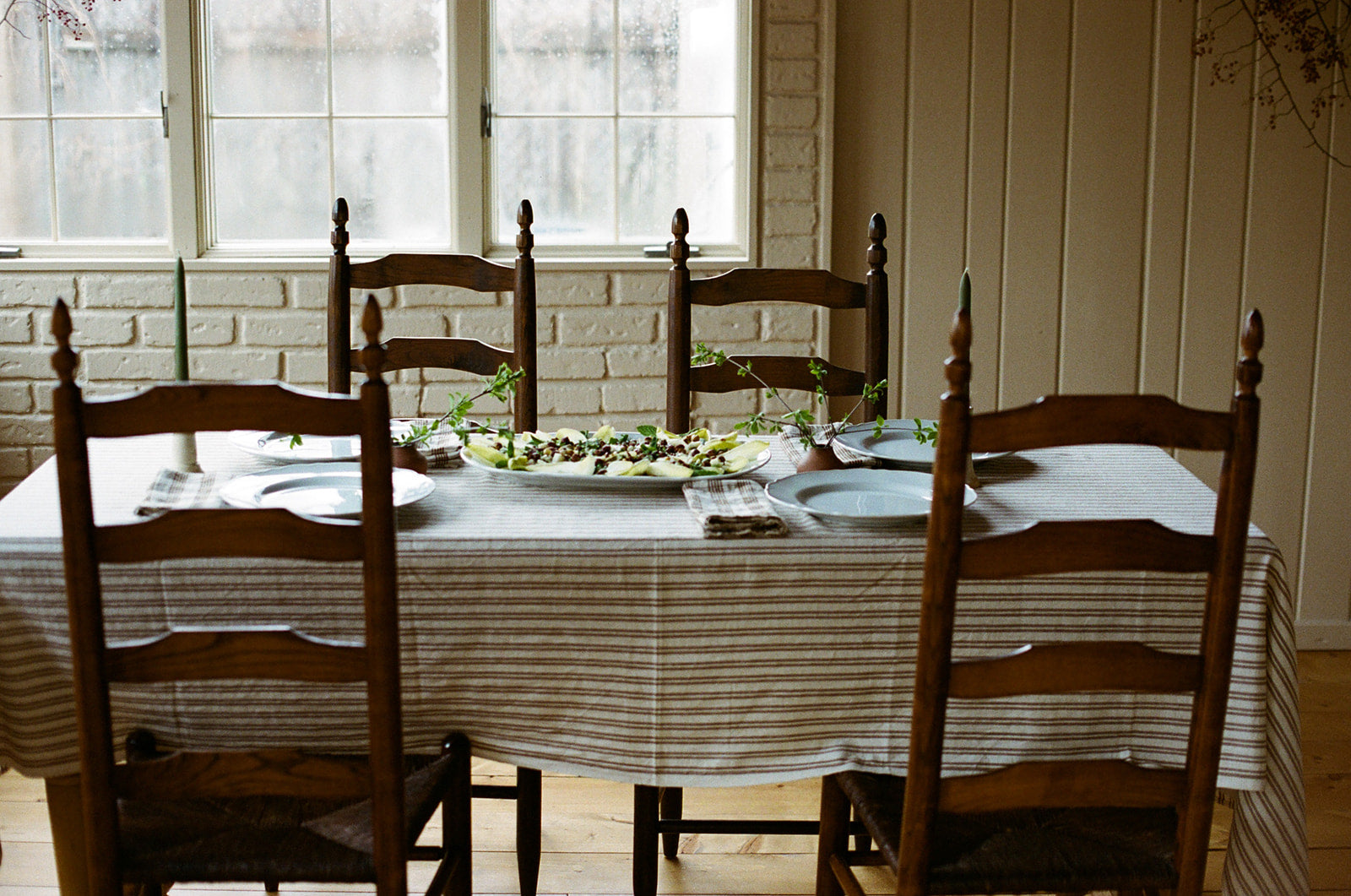 a dining table set and ready for company to arrive