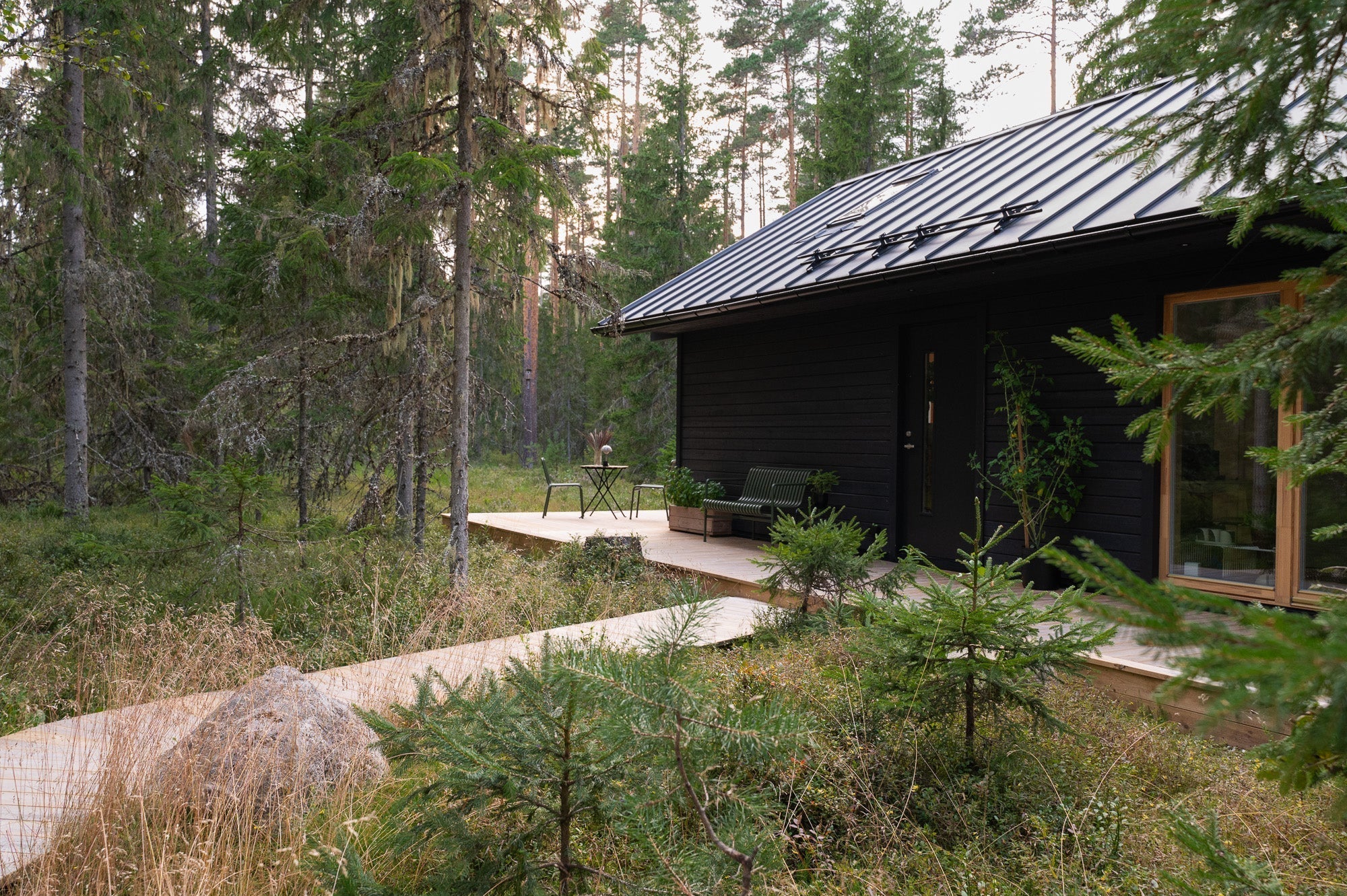 a beautiful estonian forest house, modern build, cabin