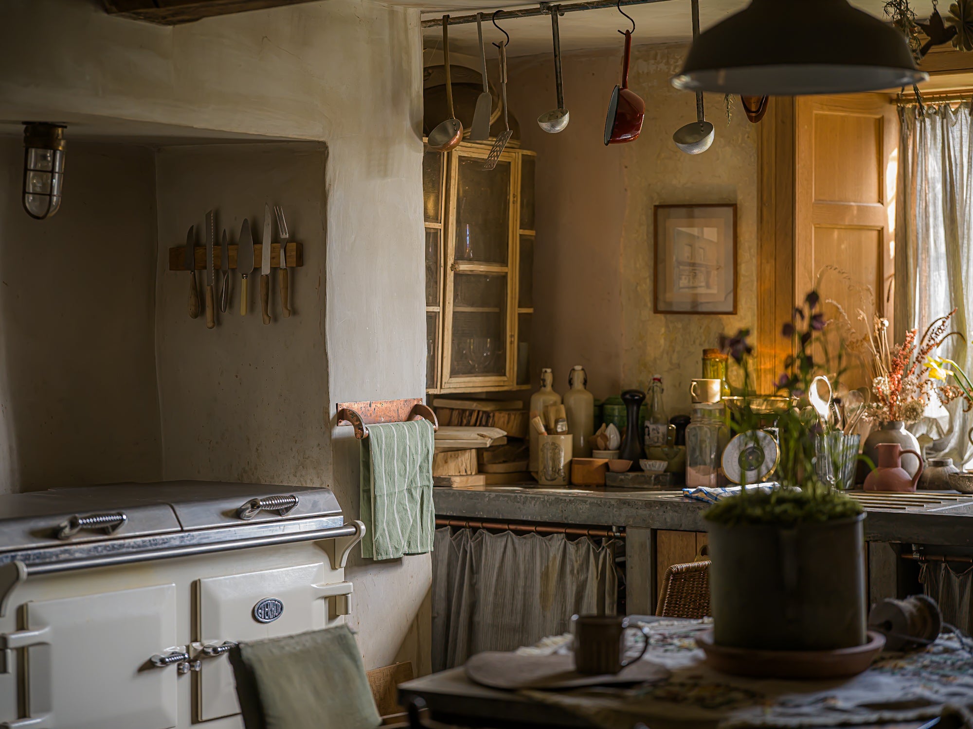 Vintage kitchen with rustic elements and a stove.